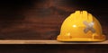 Yellow Safety Helmet with Cross Bandaid - Work Safety Concept Royalty Free Stock Photo