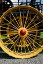 Closeup of yellow tractor wheel on an antique steam tractor Royalty Free Stock Photo