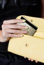 Closeup of yellow woman nails on a credit card Royalty Free Stock Photo
