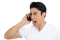 Closeup of an angry man screaming on mobile phone Royalty Free Stock Photo