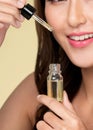 Closeup young ardent woman with healthy holding cbd oil and dropper.