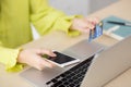 Closeup young asian business woman using smart phone and holding credit card while online shopping and payment. Royalty Free Stock Photo