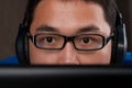 Closeup of young asian man playing on computer Royalty Free Stock Photo