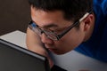 Closeup of young asian man working on laptop Royalty Free Stock Photo