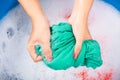 Female squeeze wring out wet fabric cloth Royalty Free Stock Photo
