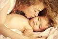 Mother kissing baby Royalty Free Stock Photo