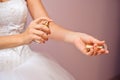 Closeup of young bride getting ready with perfumes at home in the morning Royalty Free Stock Photo