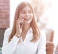 Young buisnes woman talking on a mobile phone.