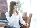 Young buisnes woman talking on a mobile phone.