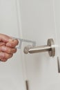 Opening a door with a non-contact opener device Royalty Free Stock Photo