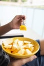 Young man eating a fruit salad outdoors Royalty Free Stock Photo