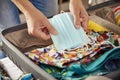 Man packing face masks in his holidays suitcase Royalty Free Stock Photo