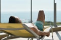 Young man sun tanning in a sunlounger Royalty Free Stock Photo