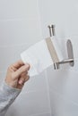 Man getting the last piece of toilet paper