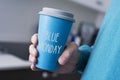 Man and cup of coffee with the text blue monday