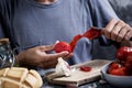 Man peeling scalded tomatoes Royalty Free Stock Photo