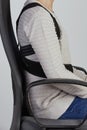 Man wearing a posture corrector while sitting Royalty Free Stock Photo