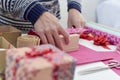 Young man wrapping a gift Royalty Free Stock Photo