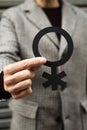 Person showing a non-binary gender symbol Royalty Free Stock Photo