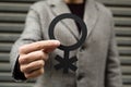 Person showing a non-binary gender symbol Royalty Free Stock Photo