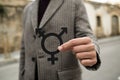 Person showing a transgender symbol