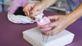 Closeup young caucasian woman hands making wool dry felting tutorial