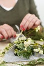 Woman arranging a bunch of mistletoe