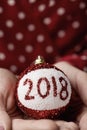 Woman with christmas ball with the number 2018 Royalty Free Stock Photo