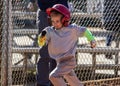 Closeup of a young child playing baseball running to first base after a hit
