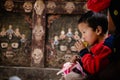 Closeup of a young child at the Tibetan Buddhist Tiji Festival in Lo Manthang, Upper Mustang, Nepal