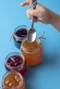 Closeup on young girl holding homemade orange jam Royalty Free Stock Photo