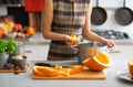 Closeup on young housewife cooking pumpkin Royalty Free Stock Photo