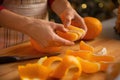 Closeup on young housewife dividing orange slices Royalty Free Stock Photo