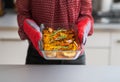 Closeup on young housewife holding baked pumpkin Royalty Free Stock Photo