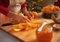 Closeup on young housewife making orange jam Royalty Free Stock Photo