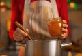 Closeup on young housewife making orange jam Royalty Free Stock Photo