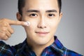 Young man applying facial cream Royalty Free Stock Photo