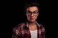 Closeup of a young man in checkered shirt and glasses Royalty Free Stock Photo