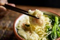 Man eating shrimp wonton noodle soup with choy sum Royalty Free Stock Photo