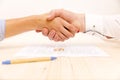 Closeup of a young man an a young woman shaking hands Royalty Free Stock Photo