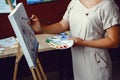 Caucasian woman artist drawing painting in art studio Royalty Free Stock Photo