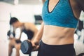 Closeup of young slim woman with six-pack muscles in the gym,Fitness and Healthy Lifstyle Concept.