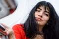 closeup of young tourist woman outdoors calm looking at the camera