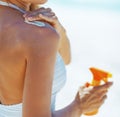 Young woman applying sun screen creme Royalty Free Stock Photo