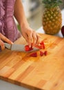 Closeup on young woman cutting strawberries in kitchen Royalty Free Stock Photo