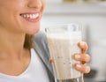 Closeup on young woman drinking smoothie Royalty Free Stock Photo