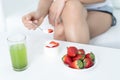 Closeup on young woman eating natural yogurt at home. Weight Los Royalty Free Stock Photo