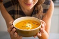 Closeup on young woman enjoying pumpkin soup Royalty Free Stock Photo