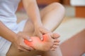 Closeup young woman feeling pain in her foot at home. Healthcare Royalty Free Stock Photo