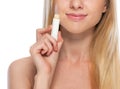 Closeup on young woman with hygienic lipstick Royalty Free Stock Photo